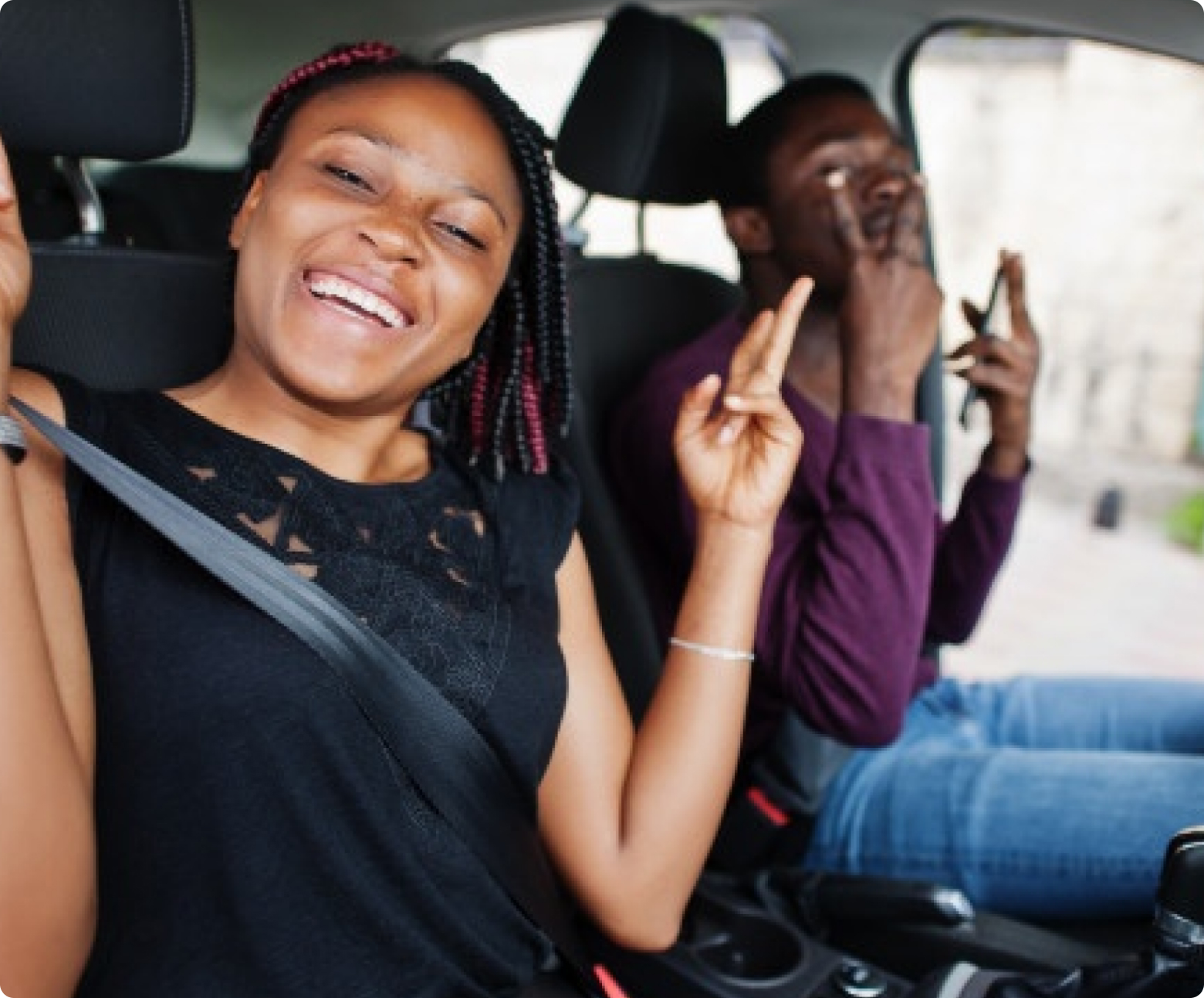 Pickmeup riders smiling in a car